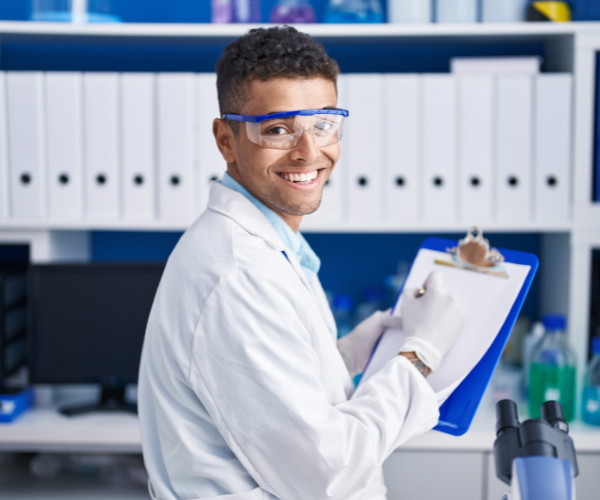 african-american-man-scientist-writing-on-document-at-laboratory