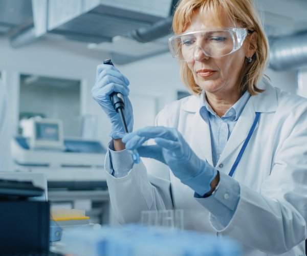 scientist-in-lab-working-with-pipette