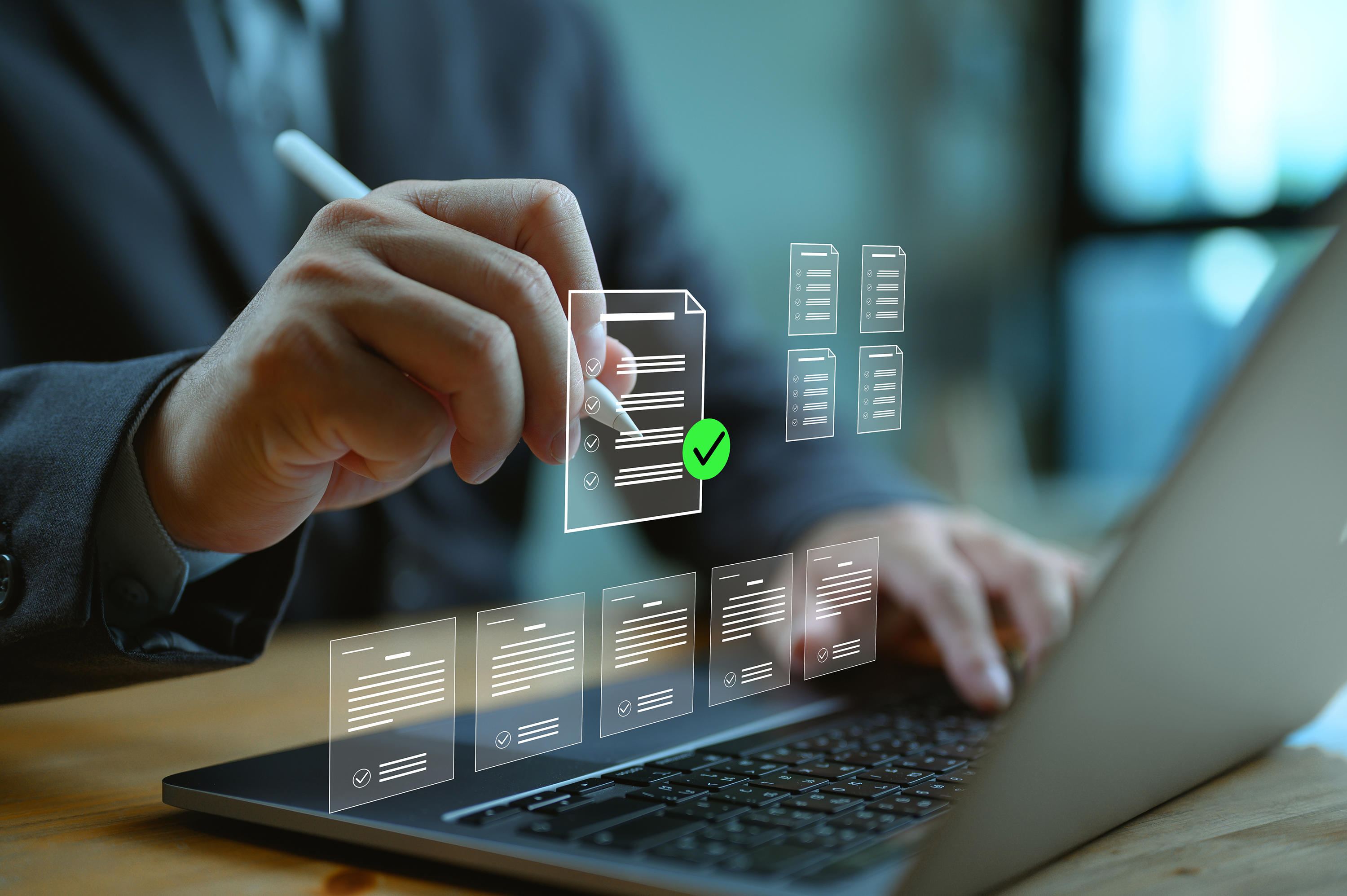 approvl-phase_man-in-business-suit-at-computer